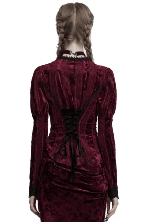 Back view of burgundy velvet gothic blouse featuring corset-style lace-up closure and adjustable waist lacing worn by model with braided twin hair