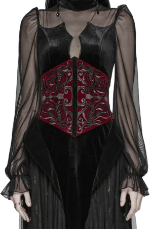 Burgundy velvet gothic corset belt with black floral embroidery worn by model, front full view showing structured silhouette and intricate scroll embroidery details