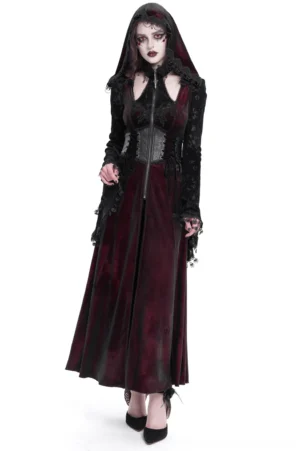 Burgundy velvet gothic hooded maxi coat with black lace sleeves and corset waist, front three-quarter view worn by model