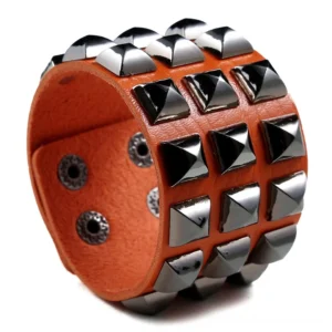 Camel tan studded leather cuff bracelet with silver square pyramid metal studs, adjustable snap fastener, gothic alternative fashion accessory