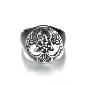 Polished stainless steel Celtic signet ring top-front view with scroll carvings around central knot