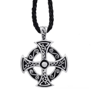 Celtic solar cross pendant necklace with intricate knot-work patterns displayed on black braided leather cord, front flat lay view showcasing silver-toned pewter craftsmanship