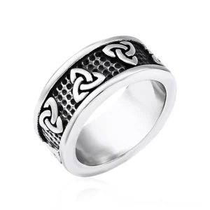 Celtic triquetra stainless steel gothic ring with embossed trinity knot pattern and hammered textured band, overhead 45-degree angle view