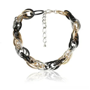 Tri-tone twisted curb chain necklace flat lay with adjustable extender, showing chunky mixed black gold and silver links