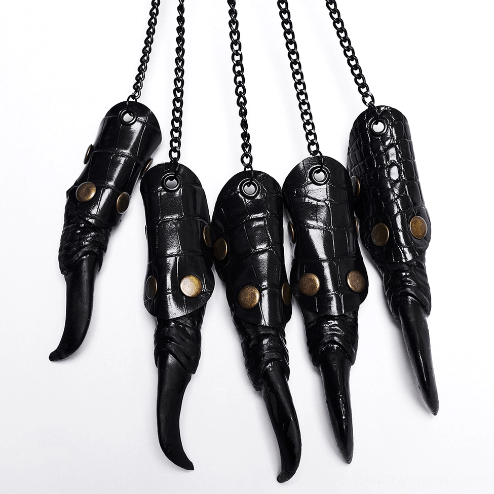 Detailed flat lay of black faux leather claw finger armor pieces with metal rivets and chain connection points