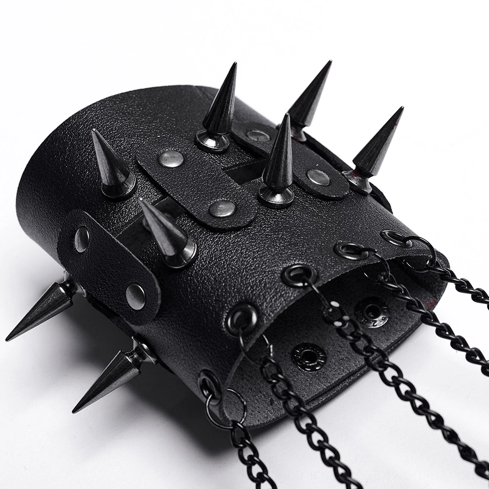 Close-up side view of spiked wrist cuff on black claw gloves with metal chain attachments