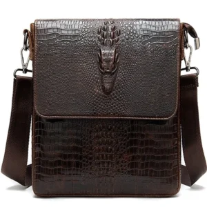 Coffee brown crocodile pattern leather shoulder messenger bag for men, front flat view with adjustable strap and metal embellishments