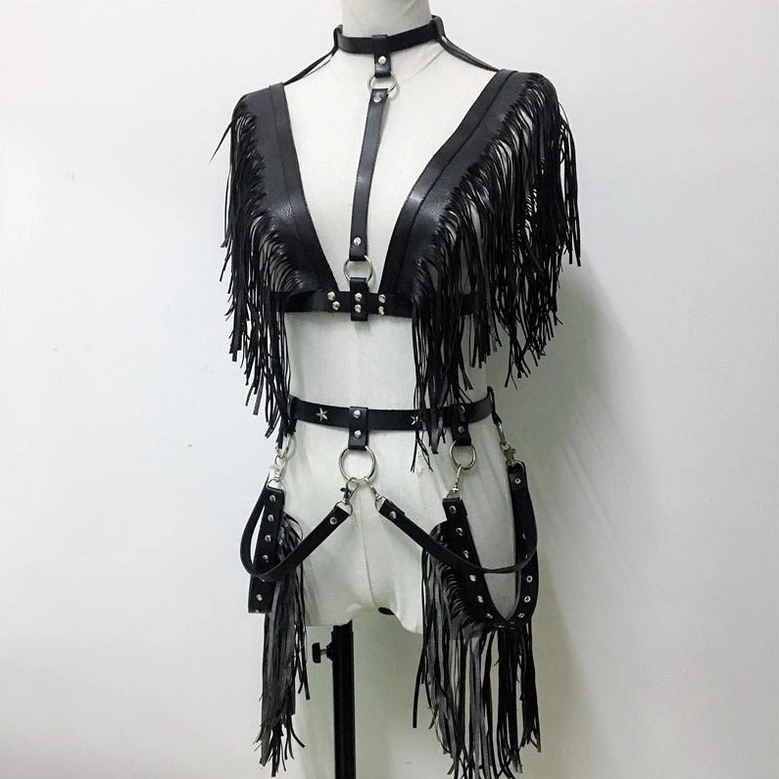 Mannequin wearing complete black leather gothic chain harness set with fringed chest piece, waist cincher, and thigh straps front view