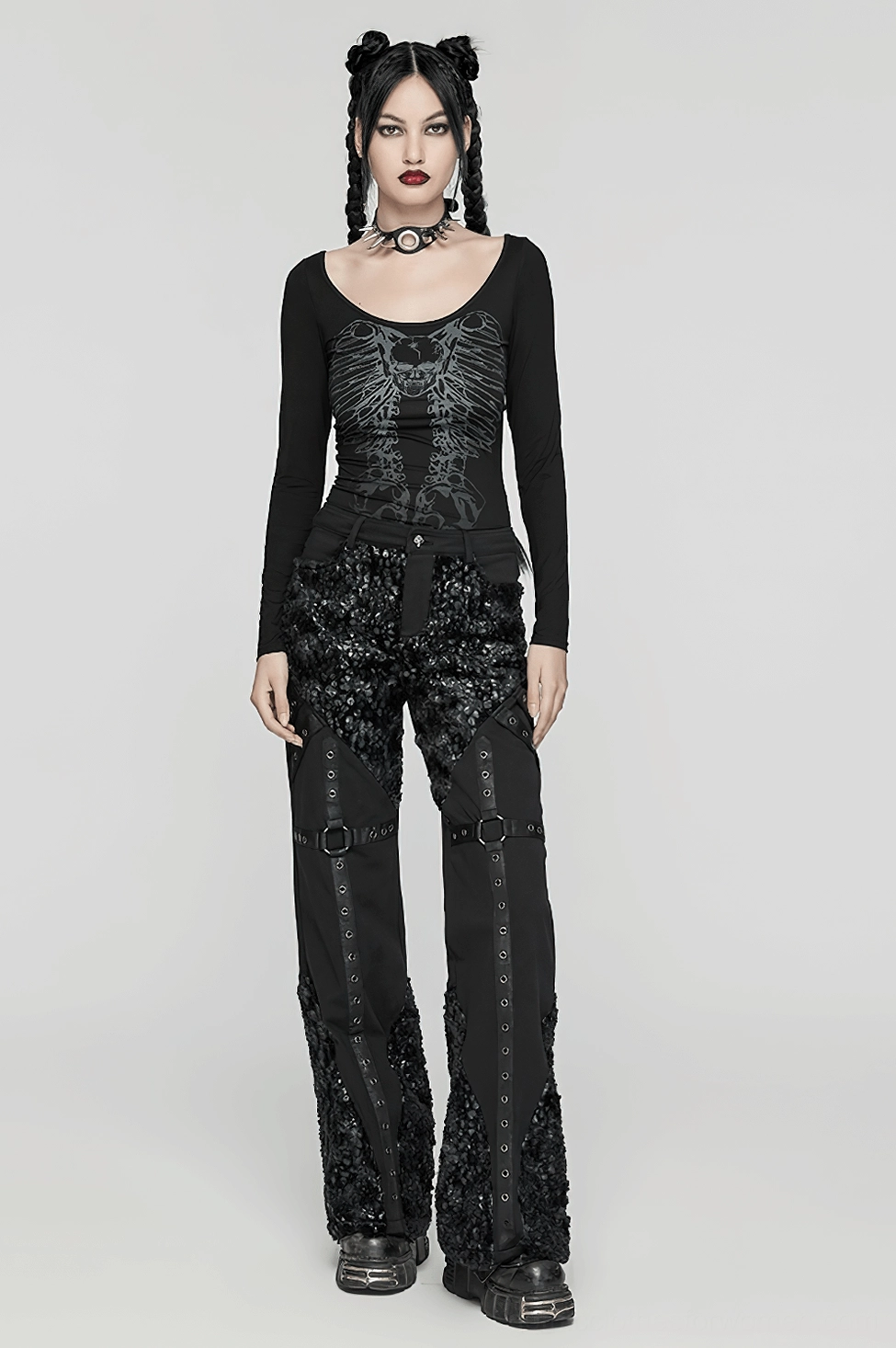 Complete gothic outfit featuring skeleton print long sleeve top paired with sequined black pants and choker worn by female model in front view