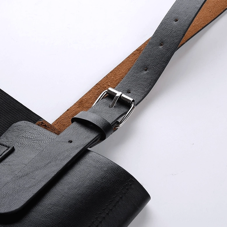 Close-up detail of corset belt - silver pin buckle and matte leather texture