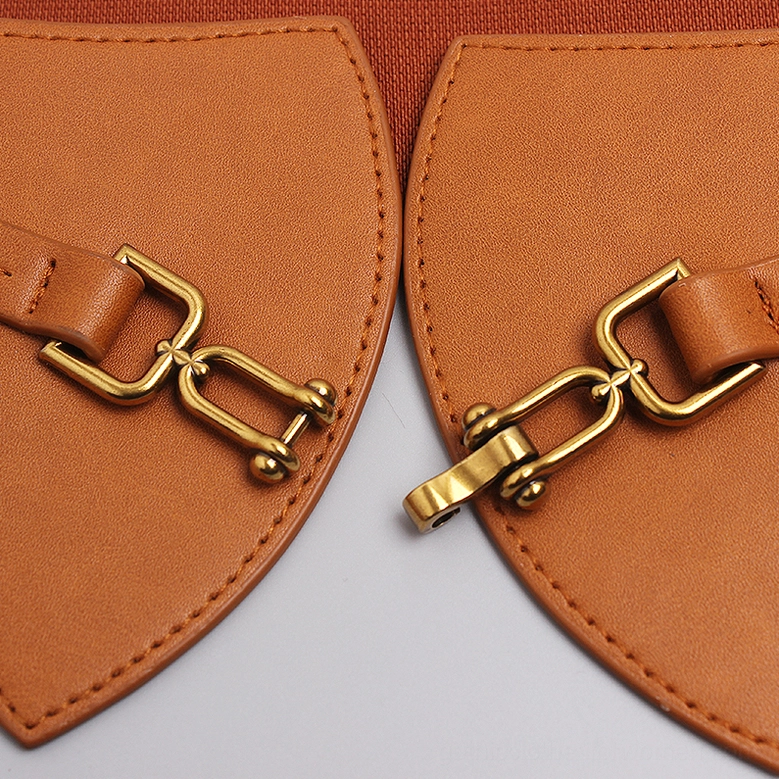 Gothic corset belt metal buckle hardware close-up - vintage gold clasp and stitched construction detail