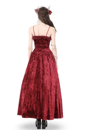 Back view of burgundy gothic velvet maxi dress showing shirred bodice and floor-length skirt