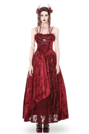 Deep crimson velvet gothic maxi dress with silver bat cross bodice front view on model with dark gothic styling