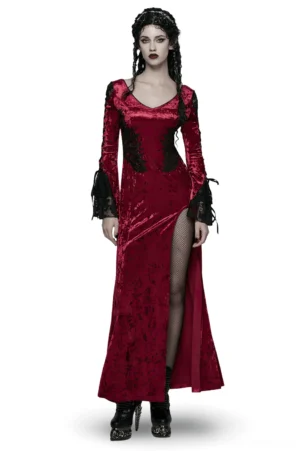 Crimson velvet gothic maxi dress front view worn by model with dark curly hair, featuring high side slit and black lace cuffs