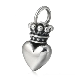 Crowned heart sterling silver pendant close-up front view, polished finish with ornate crown detail