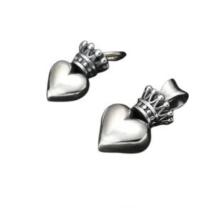 Two sized crowned heart pendants side by side, gothic silver charm comparison, large and small options