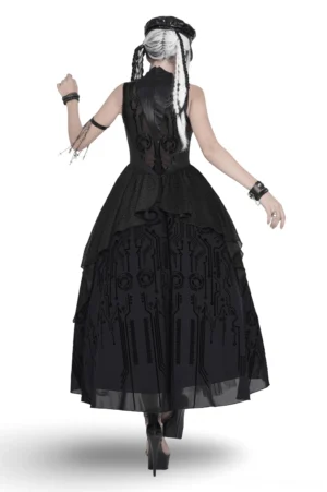 Black cyber gothic dress back view showing sheer mesh panel and ruffled circuit printed hem on model
