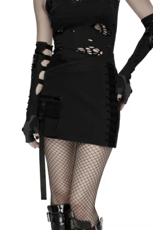 Black asymmetrical cyberpunk bodycon mini skirt with lace-up side panel and utility pocket worn by goth punk model, side rear three-quarter view