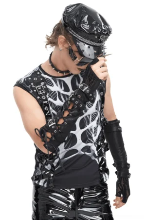 Alternative styled male model in punk outfit adjusting black cyberpunk gauntlets with buckle straps and tech print details