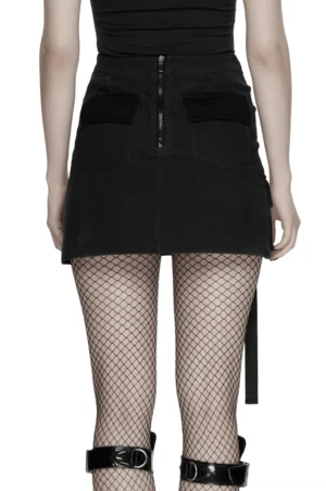 High-waisted black cyberpunk mini skirt with back zipper closure and dual front flap pockets worn with fishnet stockings, full rear view