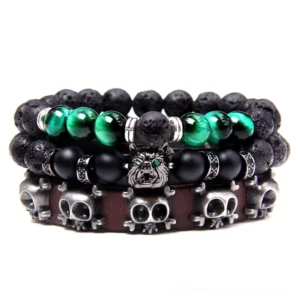 Dark mystique triple-strand charm bracelet featuring natural stone beads, genuine leather braiding, metal skull and wolf charms with dark green accent stones in gothic style