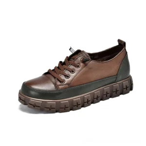 Brown and dark green two-tone platform leather sneaker, lace-up closure, side angle view