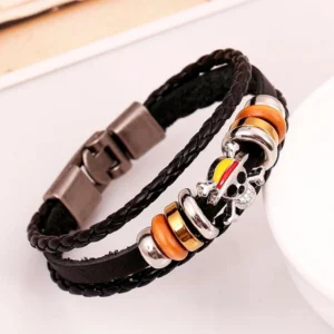 Double-layer braided leather punk bracelet featuring enamel skull decoration with silver metal hardware and orange wood beads, diagonal perspective