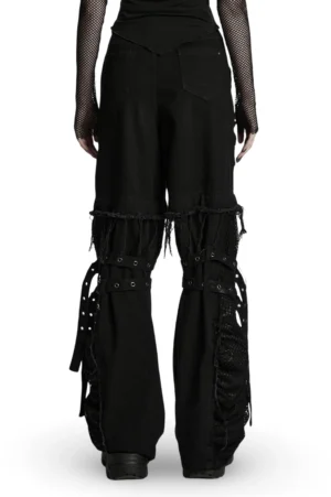 Detachable gothic pants featuring frayed hems and mesh details, rear full-length view