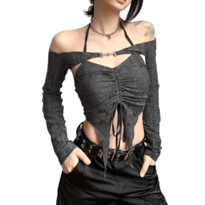 Distressed gray off-shoulder halter crop top with ruched front detail and metal buckle, worn by tattooed model on white studio background - gothic edgy long sleeve top front view