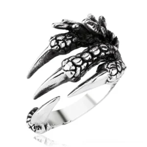 Detailed close-up of dragon claw ring showing intricate 3D geometric texture and dark metallic patina from multiple angles