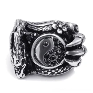 Front three-quarter perspective of dragon claw gothic ring for men, showcasing paved stone yin-yang emblem and dragon wrap design in dark silver stainless steel