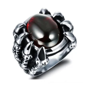 Dragon claw gothic ring with red cubic zirconia stone, silver stainless steel, front 3/4 view showing tension claw setting