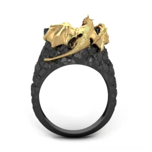 Gothic dragon statement ring rear top view displaying intricate gold dragon details and cracked black band with red accent stone