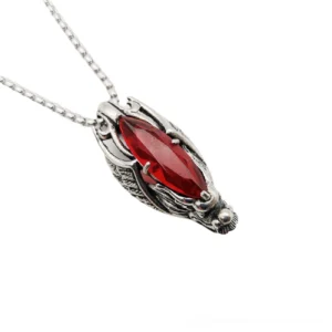 Red stone gothic dragon head pendant necklace in stainless steel, side front view showing detailed metalwork