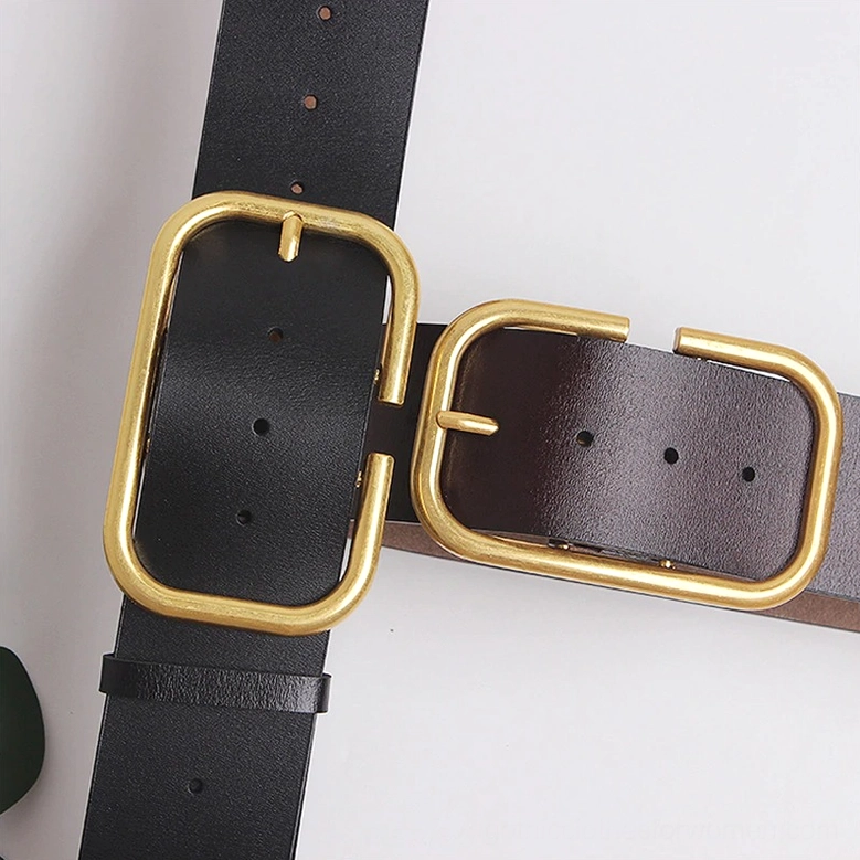 Dual corset belt buckle components showing black and burgundy leather with gold rectangular buckles