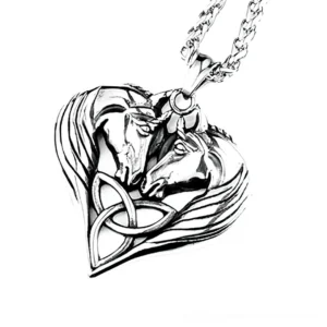 Dual horse heart gothic pendant necklace in polished silver stainless steel, close-up top view showing intricate Celtic knotwork and carved horse profile details