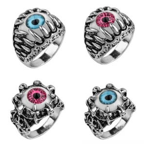 Evil eye claw ring side flat lay spiky metal frame protective talisman gothic jewelry detail