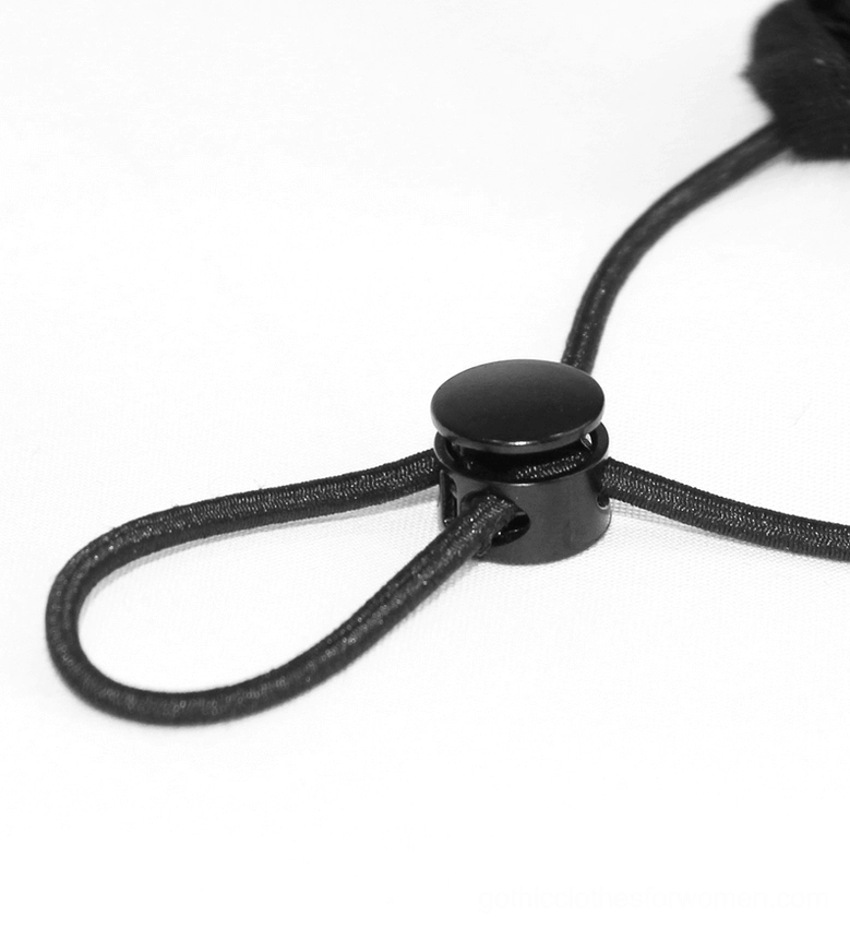 Close-up detailed shot of black plastic ear strap adjuster buckle and elastic cord mechanism on pure white background