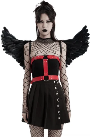 Black feather demon wings harness front view on female model wearing fishnet, red waist harness and silver chain embellishments
