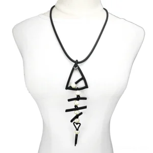 Black fish bone pendant necklace worn on mannequin, showcasing gothic style with pearl accents and heart clasp detail
