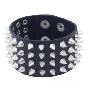 Wide spike punk gothic bangle front-facing shot displaying full four-row spike pattern across cuff width