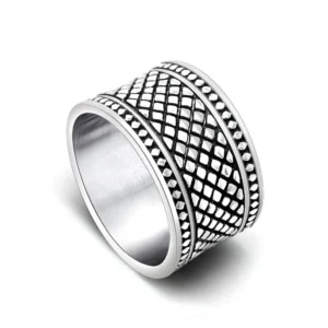 Industrial grid patterned finger ring with brushed inner surface - side angle view of stainless steel band