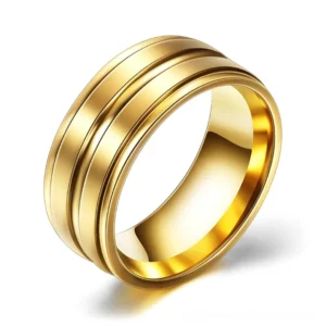 Gold stainless steel gothic band ring with precision-grooved design, front oblique studio view
