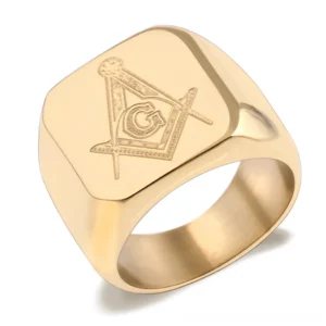 Gold tone Masonic signet ring with polished finish and engraved Freemason emblem, three-quarter front studio shot