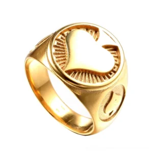 Gold spade ring worn on male hand, close-up view showing gothic signet design and polished finish