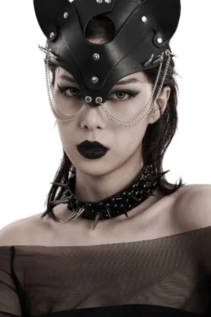 Spiked faux leather gothic choker and coordinating cat ear mask on model, alternative fashion styling, close-up front angle
