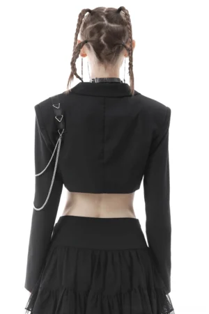 Black cropped goth jacket with shoulder chain details, back view on model showing exposed midriff