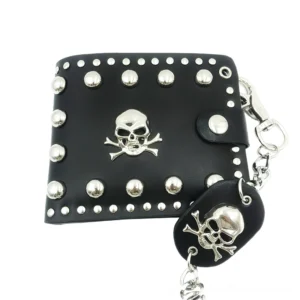 Front view of studded skull wallet showing all-over silver rivets, central skull emblem, and snap closure detail