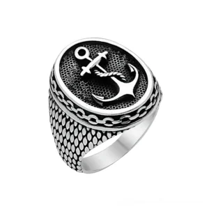 Gothic unisex anchor signet ring in blackened stainless steel with scale-textured band and rope-detailed anchor emblem, front oblique view