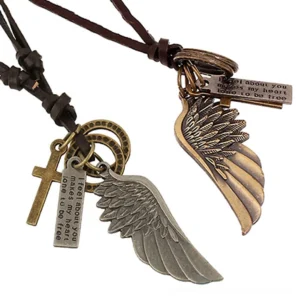 Brown leather adjustable gothic necklace with bronze-toned angel wing, cross, and text tag pendants, flat lay top-down view